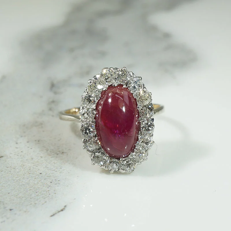 timeless engagement rings -Magnificent Ruby Cabochon in Diamond Halo Ring