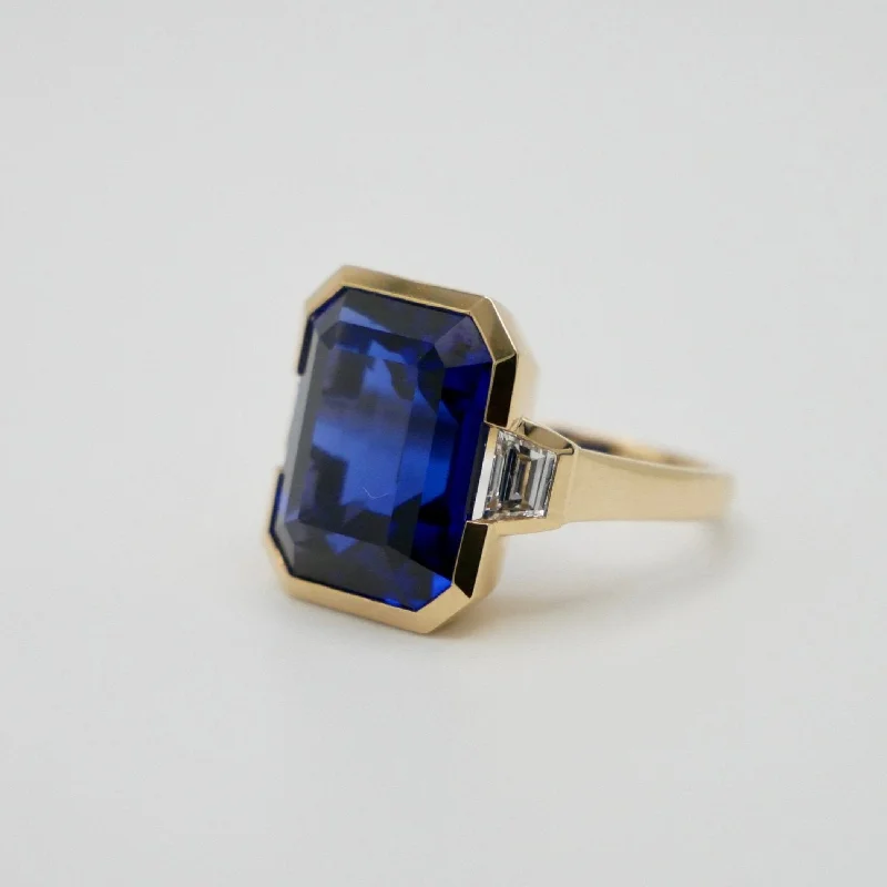 opal rings for women -12 Ct Lab Grown Emerald Cut Sapphire with Trapezoid Diamonds 18K Yellow Gold Bezel Three Stone Ring